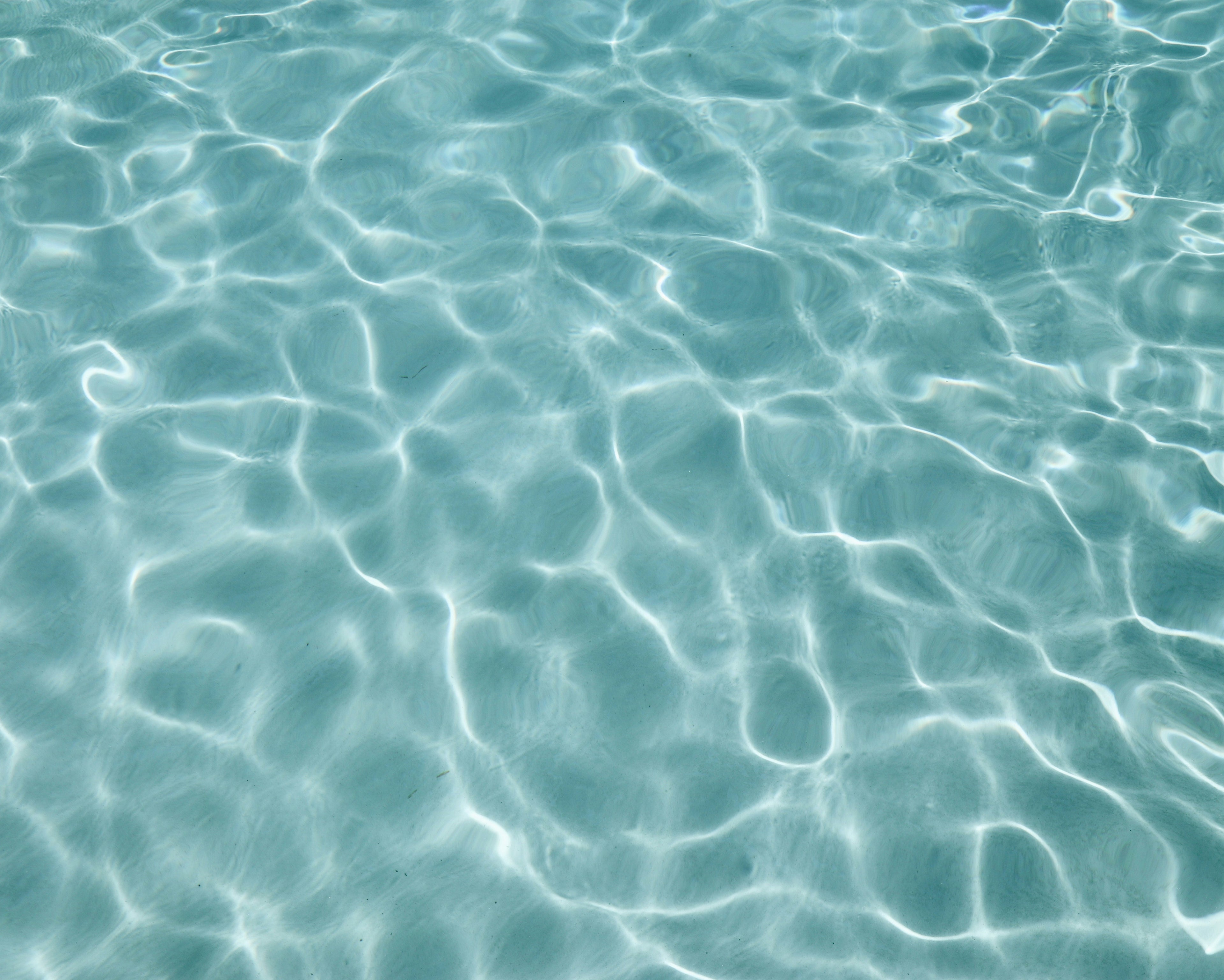 Calm ocean water, representing the eco-conscious and serene values of Mālie the label